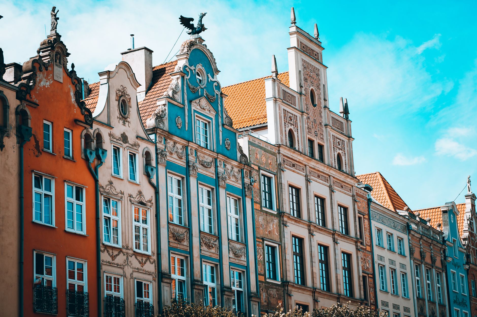 Vibrant Gothic architecture of historic facades in Gdańsk, showcasing iconic European style.