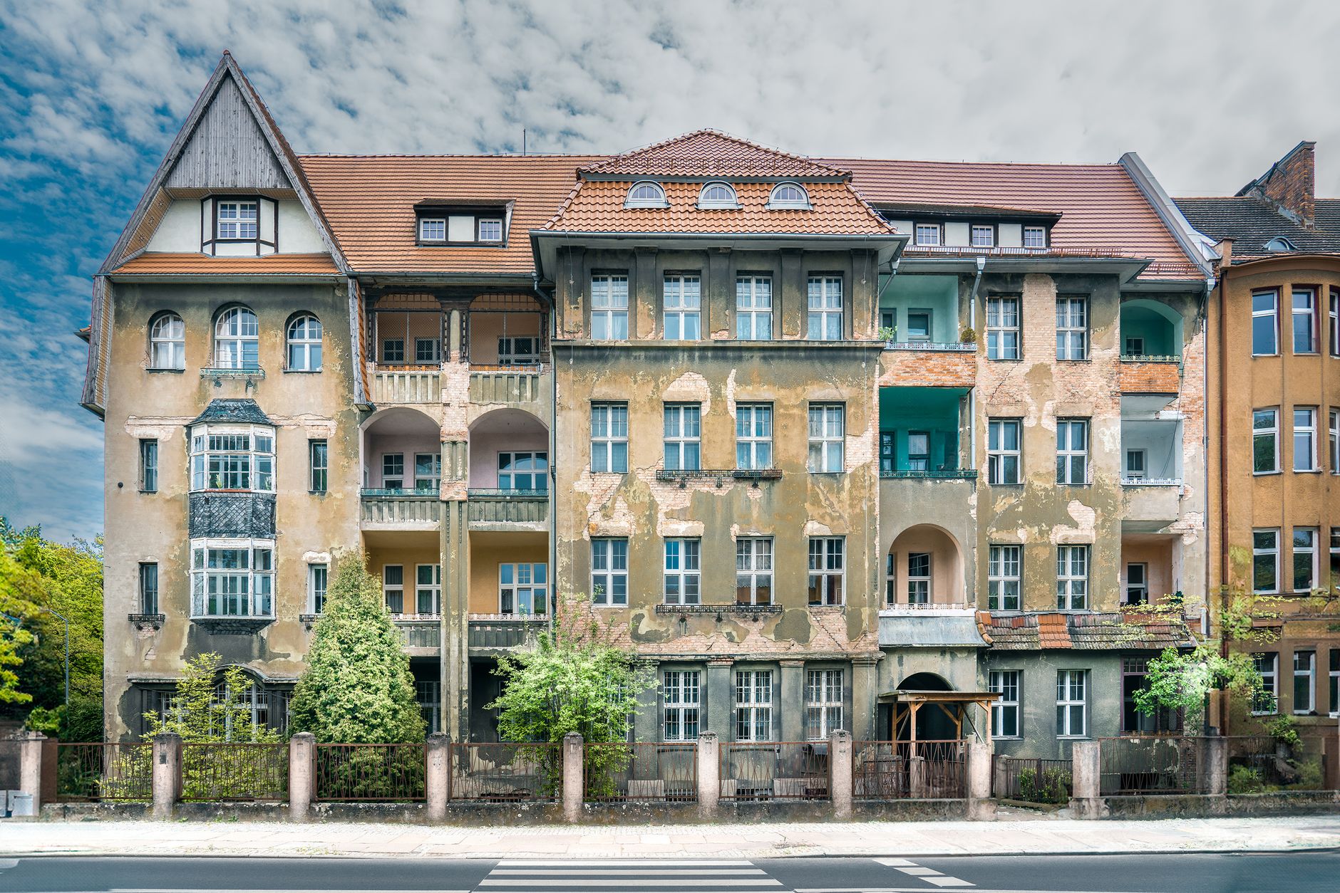 Detailed facade of a historic tenement building with urban decay, located in Szczecin, Poland.