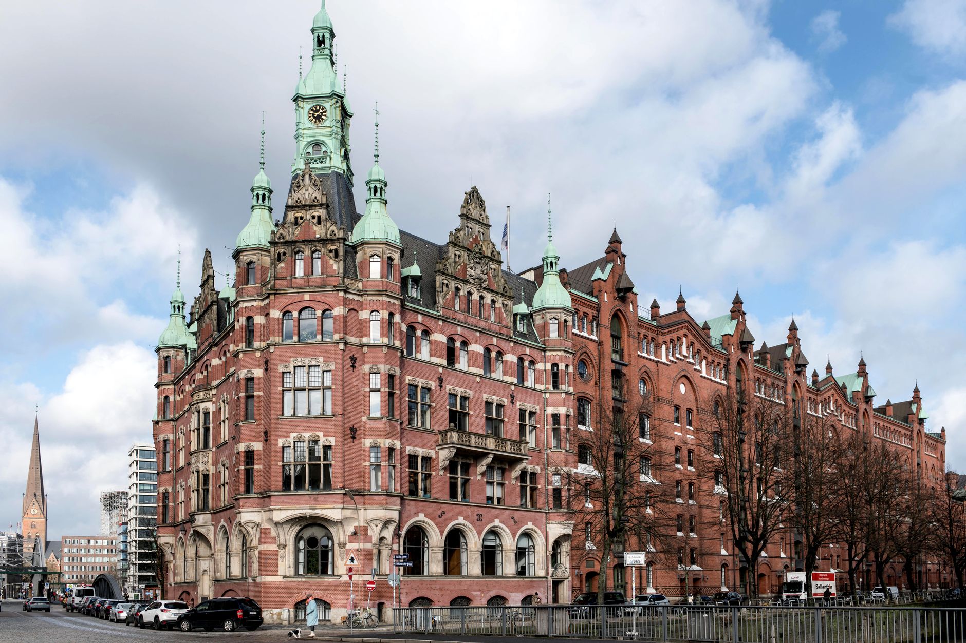 Iconic view of the Speicherstadt district's historic architecture in Hamburg, Germany under a cloudy sky.